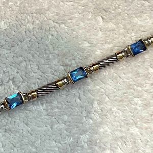 Beautiful silver and gold toned bracelet with blue stones